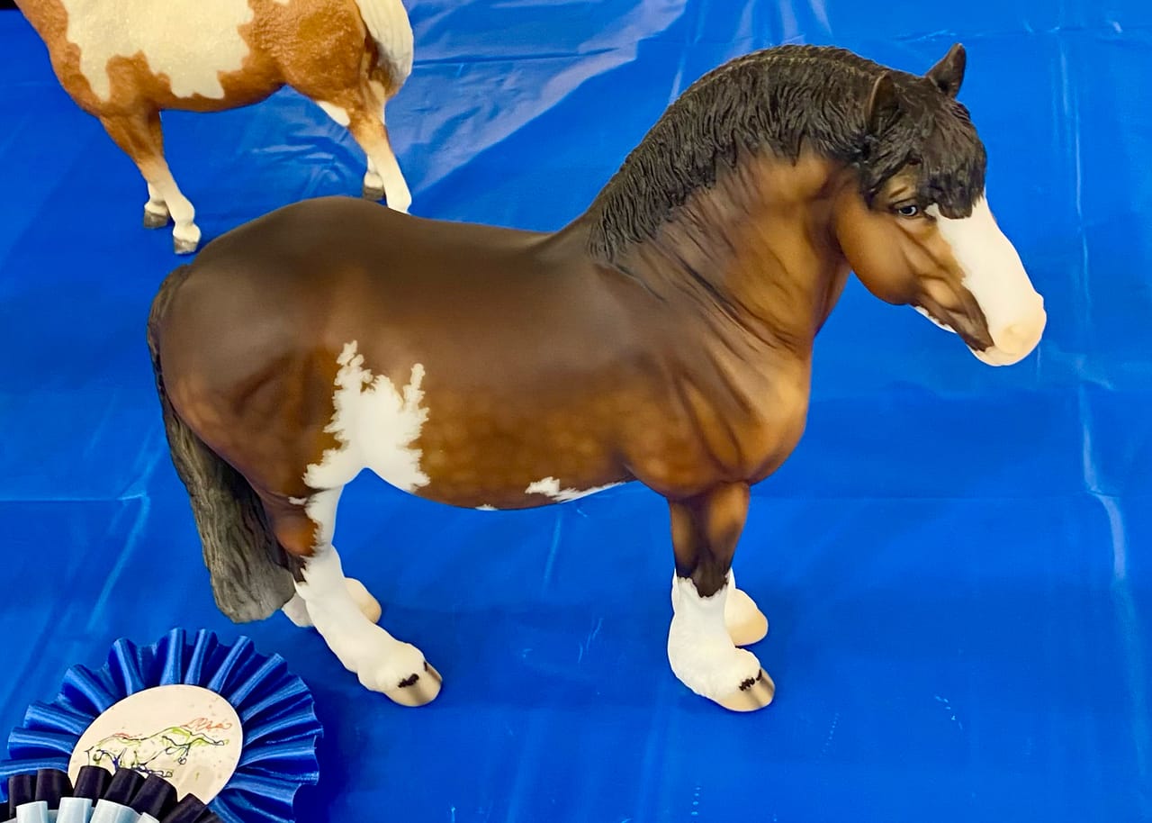 Model horse with show ribbons